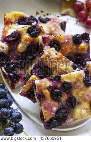 Traditional Italian Yeast Dough Pie With Grapes Schiacciata And Bunches Of Grapes On A Light Backgro