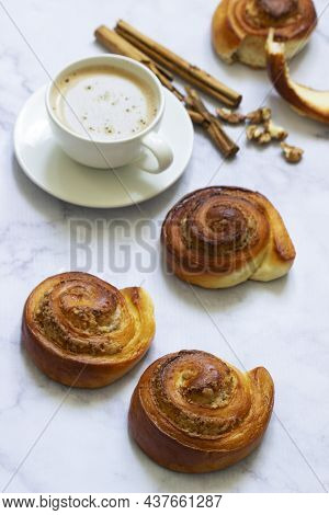 Cinnamon Rolls With Nut Filling, Served With Coffee.