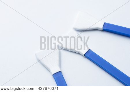 Three Sensor Cleaning Swabs On White Background
