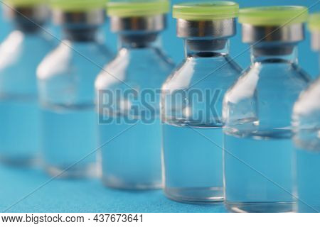 Close-up Of Glass Vials With Liquid Samples In Laboratory, Vaccine In Bottles, Medicine In Ampoules.