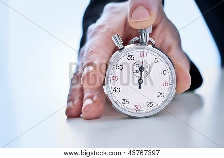 Human hand showing a stopwatch