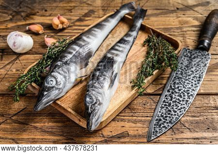 Raw Mackerel Icefish In A Wooden Tray. Wooden Background. Top View