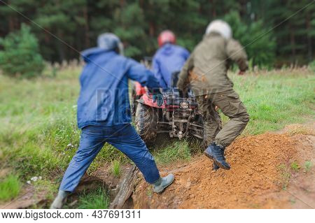 Group Of Riders Riding Atv Vehicle On Off Road Track, Process Of Driving Atv Vehicle, All Terrain Qu
