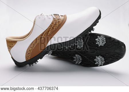Close-up Of Pair Of Modern Fashionable Shoes With Unique Design, White With Combination Of Gold Colo