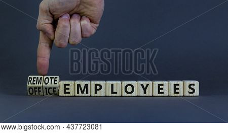 Remote Or Office Employees Symbol. Businessman Turns Cubes And Changes Words Office Employees To Rem