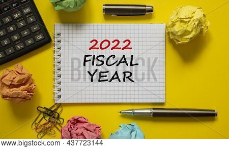 2022 Fiscal New Year Symbol. White Note, Words 2022 Fiscal Year On Beautiful Yellow Table, Colored P