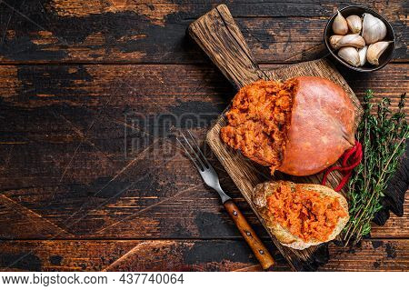 Sobrassada Cured Pork Meat Sausage On Bread Slice. Dark Wooden Background. Top View. Copy Space
