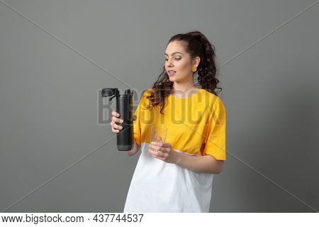Teenager Holding Eco Reusable Smart Thermo Water Bottle With Drink Reminder, Health Care Concept