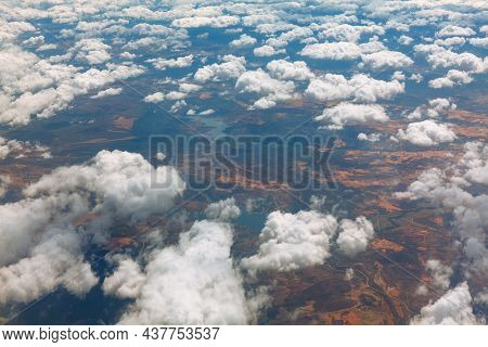 Altocumulus Clouds View From Above  . Flight Panorama Of White Clouds And Earth