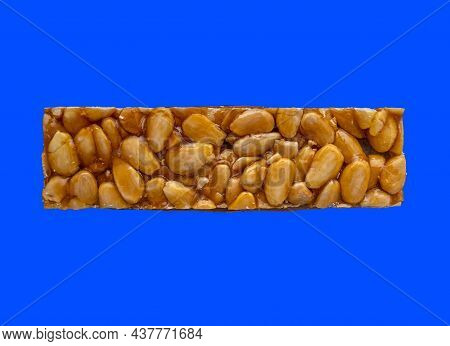 Top View Of Christmas Turron Over Blue Background.