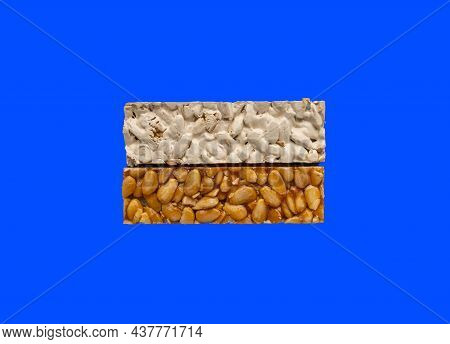 Top View Of 2 Different Types Of Spanish Turrons On Blue Background