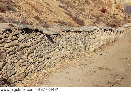 Stone Fence Along The Road Near The Village Of Ranipauwa. Mustang District, Nepal