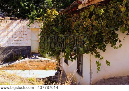 Scenic View Of Narrow Winding Ancient Street With Old Houses At Historical Center Of Avanos. Popular