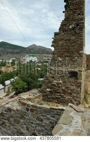 View Of Sudak From The Genoese Fortress. Rocky Mountains, City View From The Mountain. Sudak, Crimea