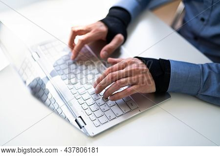 Pain Relief Bandage And Wrist Strap. Typing On Keyboard
