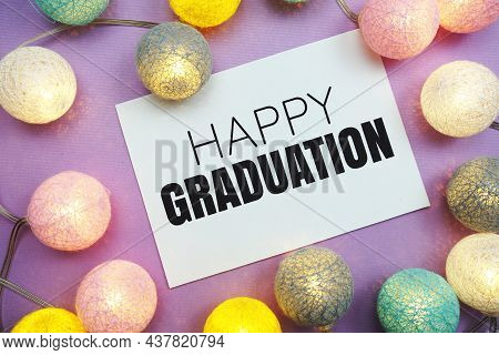 Happy Graduation Text With Led Cotton Balls Decoration On Purple Background