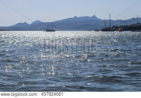 Blue Sea Sparkling In The Sun. Beautiful Coast With Islands, Mountains And Yachts