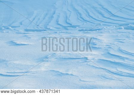 Snowy Background, Snow-covered Surface Of The Earth After A Blizzard In The Morning In The Sunlight 