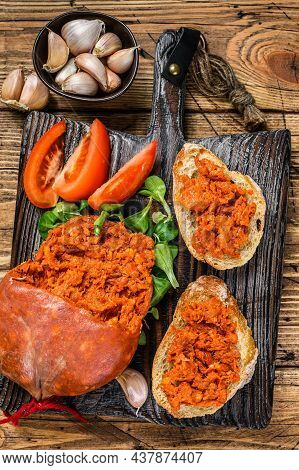 Tapaa Sandwichs With Sobrassada Cured Pork Meat Sausage And Tomato On A Wooden Cutting Board. Wooden
