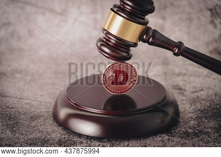 Representative Cryptocurrency Under The Judges Gavel In The Foreground.