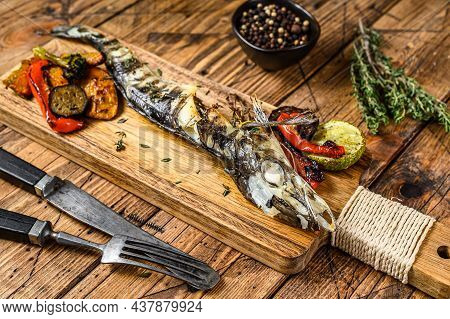 Grilled Whole Icefish With Vegetables. Wooden Background. Top View