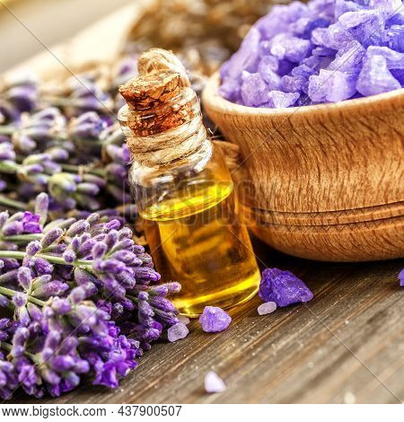 Lavender's Spa Products With Dried Lavender Flowers On A Wooden Table. Flat Lay Bath Salt And Massag