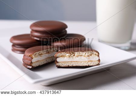 Tasty Choco Pies And Milk On White Wooden Table, Closeup View