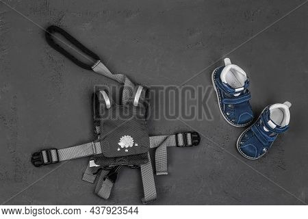 Baby Leading Strings And Orthopedic Shoes The First Steps Of The Child. Protect The Child From Falli