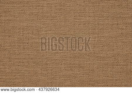 Close-up Of Brown Woven Surface. It Looks Like The Texture Of Linen. Abstract Background From Fabric
