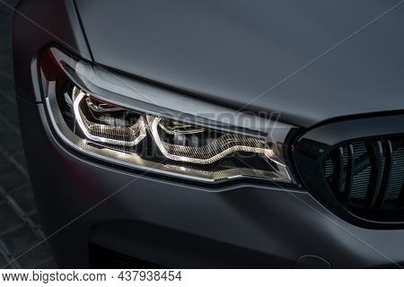 Ukraine, Odessa July 8 - 2021: Headlight Of Modern Prestigious Sports Car Bmw M5. Super Car Front Li