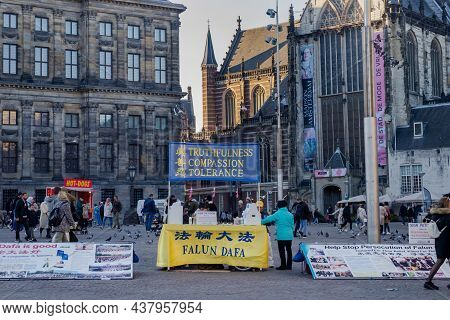 24 October 2021, Amsterdam, Netherlands, Falun Dafa Activists  In Dam Square Spreading Their Believe
