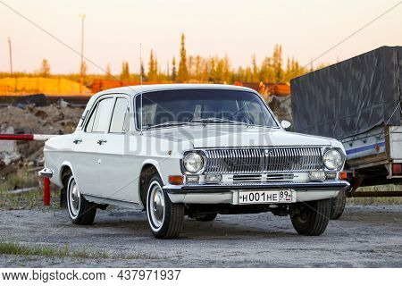 Pangody, Russia - June 12, 2021: Soviet Retro Car Gaz 24 Volga In A City Street.