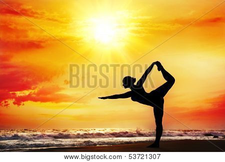 Yoga Silhouette On The Beach
