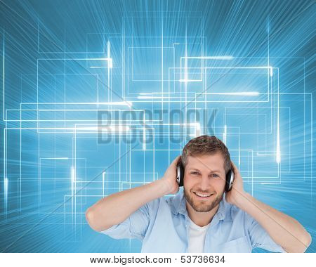 Composite image of trendy model  listening to music and looking at camera
