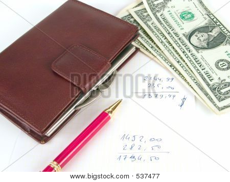 US dollars, notesbog og pen