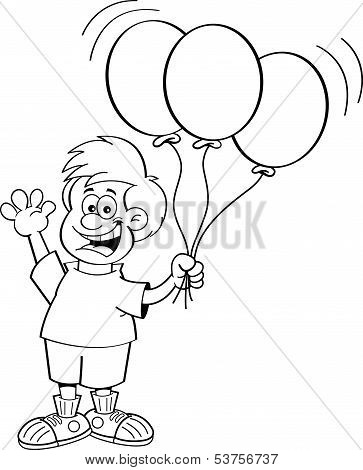 Boy holding balloons