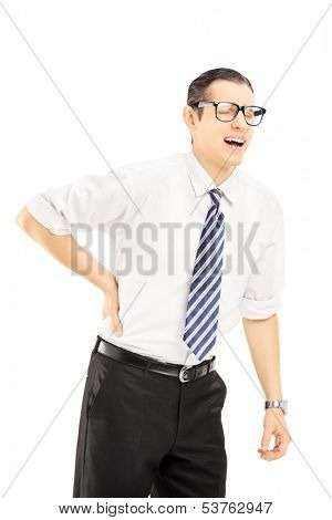 Young man with tie suffering from a back pain isolated on white background