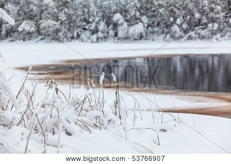 Winter Lake Shore With Opened Water In Ice