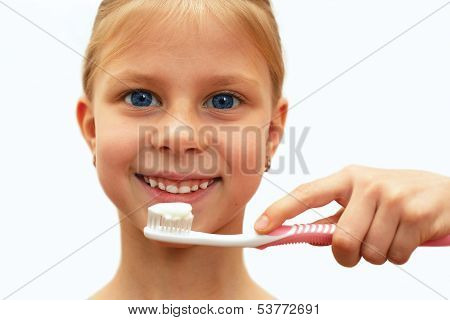Girl With Healthy Teeth Holding A Toothbrush