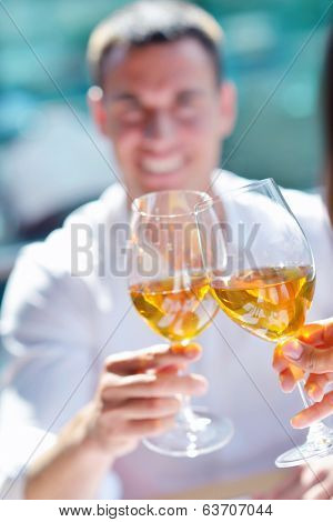 happy young couple having lanch at beautiful restaurant on by the sea on  beach