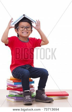 Cute boy reading a book