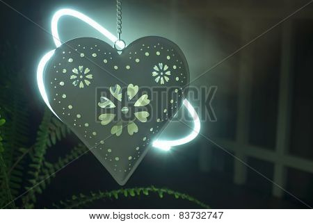Heart Shape And Light From A Candle