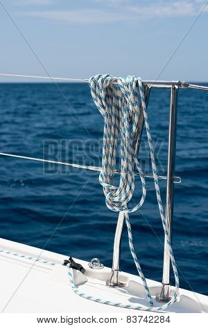 A Rope Tied Around A Lifeline On A Yacht