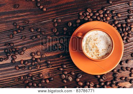 Cup of coffee with coffee beans