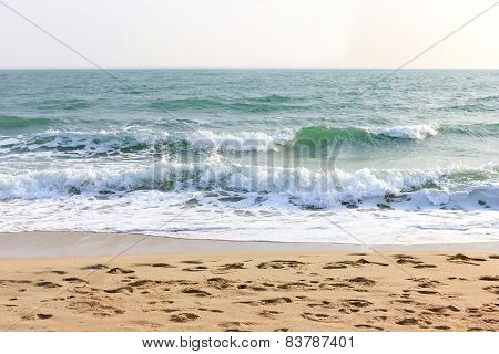 Waves on the beach white sky
