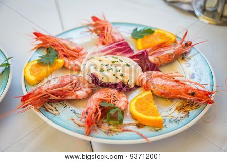 Dish with shrimp on the table in the restaurant.