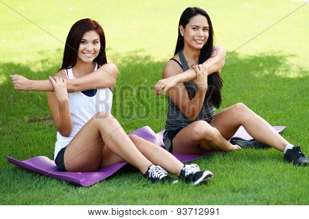 Group of people doing a boot camp workout outside
