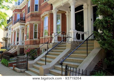 Gorgeous line of row houses on quiet city street