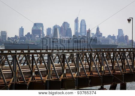 JERSEY CITY, NJ - MAY 26 2015: USS San Antonio (LPD 17) passes Lower Manhattan on the Upper New York Bay after departing Pier 92 at the end of Fleet Week NY 2015.