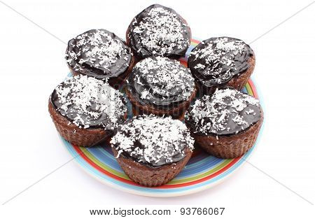 Fresh Baked Chocolate Muffin With Desiccated Coconut On Colorful Plate